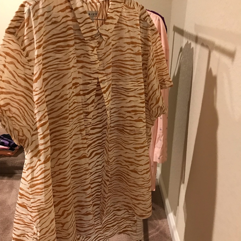 Ladies short sleeve zebra print top with front pocket, button up with collar